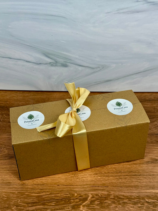 Les Délices gift box tied with gold ribbon and PrismaCasa Design stickers